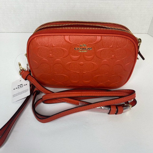 Coach camera bag with signature coated canvas detail. Shoulder/wrist strap.Coral - Picture 4 of 8